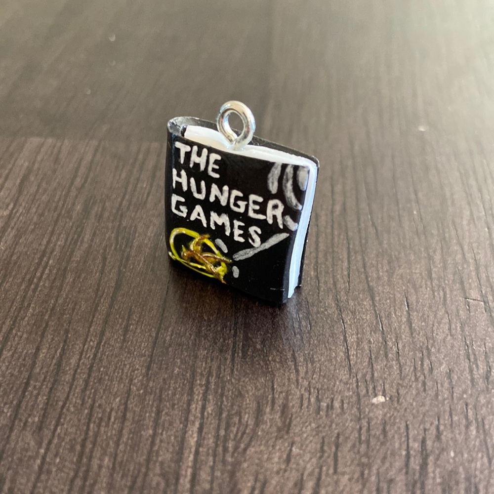 The Hunger Games Inspired Book Cover polymer clay art charm. One size.